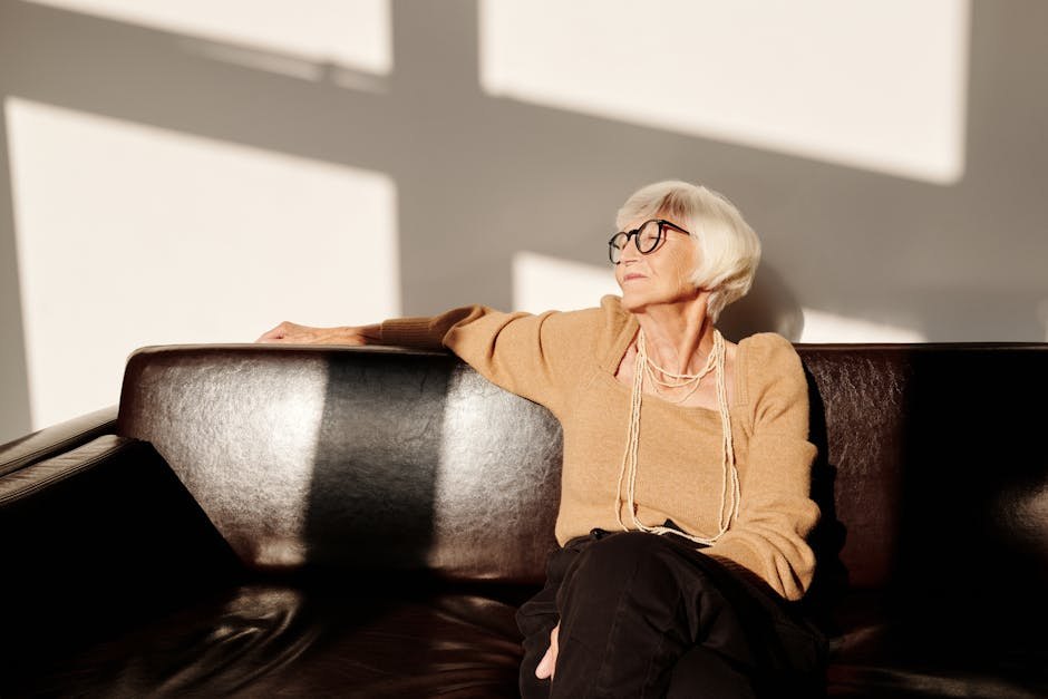A confident woman in midlife in warm, natural window light